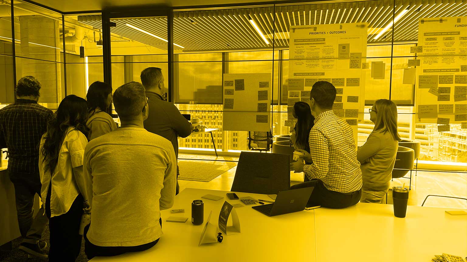 People working in a room to create innovation statements